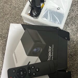 Compact Black and White Projector with Remote